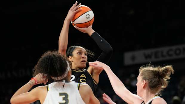 Aces forward A’ja Wilson shoots a basketball